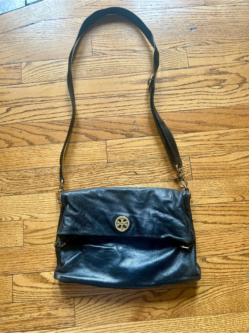 Tory Burch Black Leather Crossbody with Gold Logo.